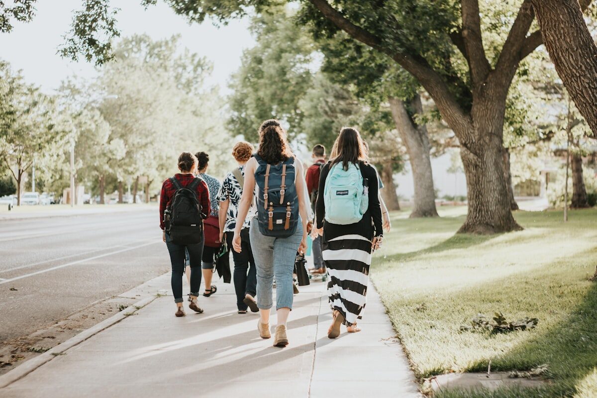 Students walking across a university campus